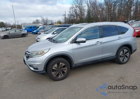 2016 Honda Cr-V Touring z USA, uszkodzony, nr VIN 5J6RM4H90GL067898